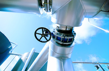 Image showing Industrial zone, Steel pipelines and valves against blue sky