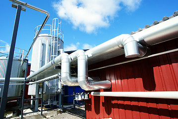 Image showing Industrial zone, Steel pipelines and valves against blue sky