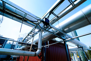 Image showing Industrial zone, Steel pipelines and valves against blue sky