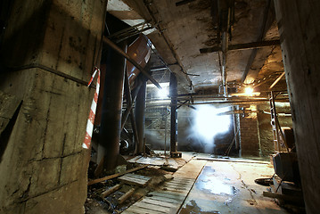 Image showing Old creepy, dark, decaying, destructive, dirty factory