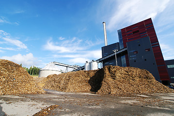 Image showing bio power plant with storage of wooden fuel (biomass) against bl