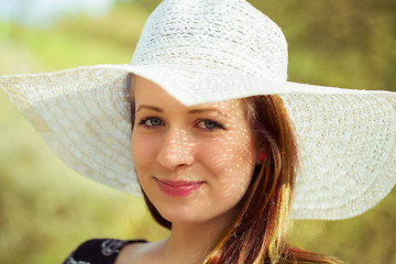 Image showing Portrait of cheerful fashionable woman in stylish hat
