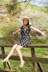 Image showing Cheerful fashionable woman in stylish hat and frock posing