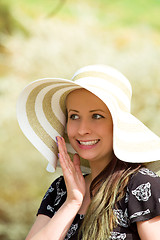 Image showing Cheerful fashionable woman in stylish hat and frock posing