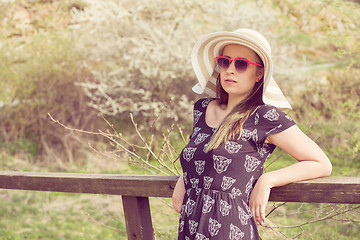 Image showing Cheerful fashionable woman in stylish hat, frock and sunglasses