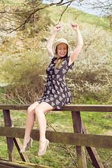 Image showing Cheerful fashionable woman in stylish hat and frock posing