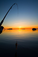 Image showing Sunset river perch fishing with the boat and a rod