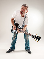 Image showing Full length portrait of a guitar player 