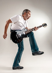 Image showing Full length portrait of a guitar player 