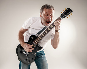 Image showing portrait of a guitar player 