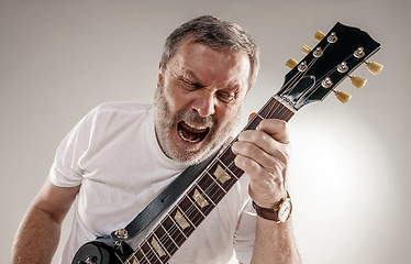 Image showing portrait of a guitar player 