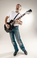 Image showing Full length portrait of a guitar player 