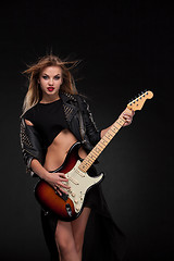 Image showing Beautiful girl playing guitar