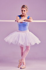 Image showing classic ballerina posing at ballet barre