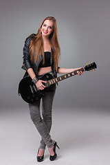 Image showing Beautiful girl playing guitar