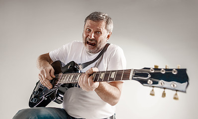 Image showing portrait of a guitar player 