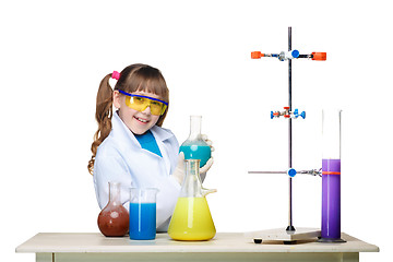 Image showing Little girl as chemist doing experiment with chemical fluid in the laboratory