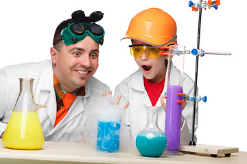 Image showing Teen and teacher of chemistry at  lesson making experiments