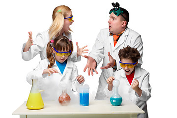 Image showing Teens and teachers of chemistry at  lesson making experiments