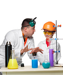 Image showing Teen and teacher of chemistry at  lesson making experiments