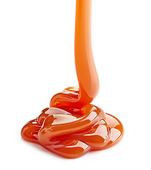 Image showing pouring caramel sauce