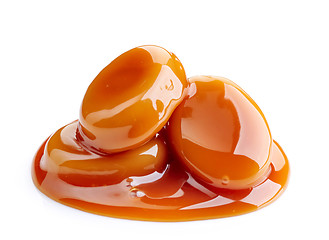 Image showing caramel candies and sauce