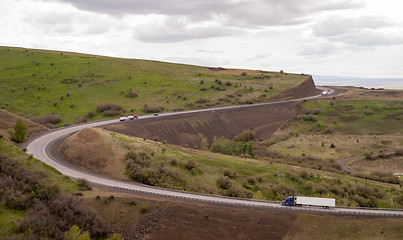 Image showing Open Road Semi Trucks Travel Curved Highway Oregon Countryside