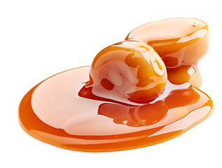 Image showing caramel candies and sauce