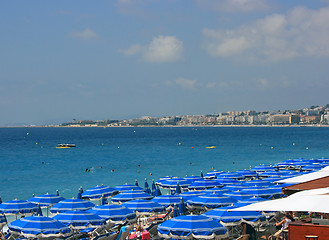 Image showing Beach with blue umbrellas 2