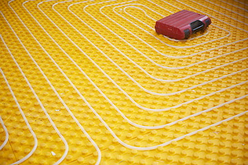 Image showing workers installing underfloor heating system