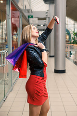 Image showing beautiful young woman goes shopping