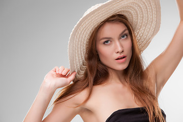 Image showing Beautiful girl with hat posing in studio