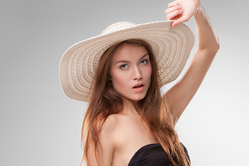 Image showing Beautiful girl with hat posing in studio