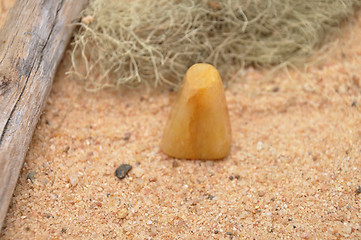Image showing Orange calcite on beach