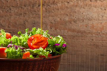 Image showing Fresh salade on wooden background