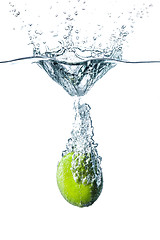 Image showing Fresh lime falling into water