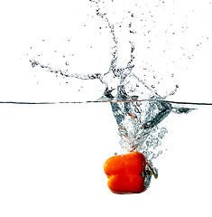 Image showing Pepper drops into a water 