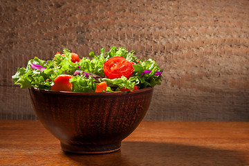 Image showing Fresh salade on wooden background