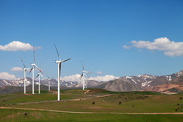 Image showing Wind farm at sun spring day