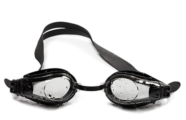 Image showing Black goggles for swimming with water drops