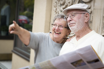 Image showing Tourist Senior Couple Looking at Brochure Map