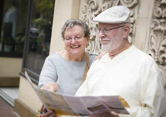 Image showing Tourist Senior Couple Looking at Brochure Map