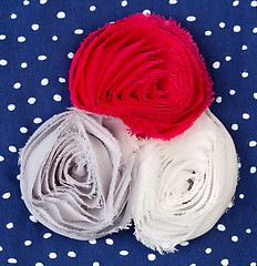 Image showing Three colored fabric flower