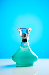 Image showing Green bottle of perfume for women