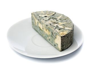 Image showing Cheese with black mold on a plate for food lovers.