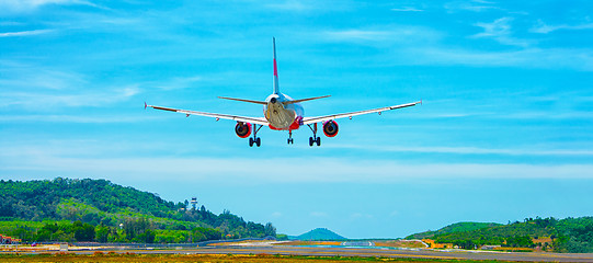 Image showing Commercial Airliner Landing at an Airport in Southeast Asia