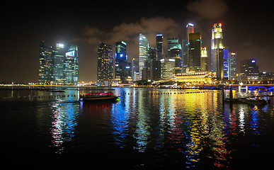 Image showing Brilliantly Lit Singapore Skyline from the Harbor at Night