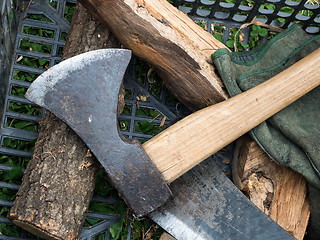 Image showing Old Axe and splinters of wood