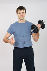 Image showing athlete with a dumbbell shows class