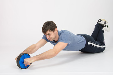 Image showing The athlete is pushed by a wheel